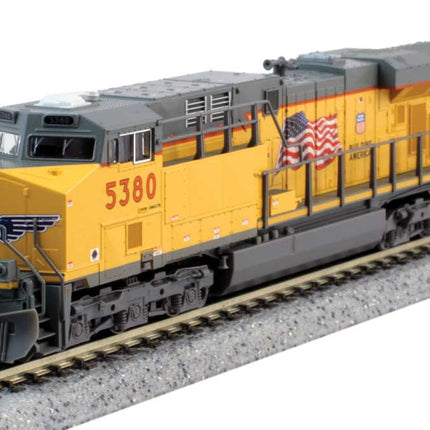 381-1768955, Kato (N Scale) GE ES44AC GEVO - Standard DC -- Union Pacific #5553 (Armour Yellow, gray, US Flag, Building America Logo)